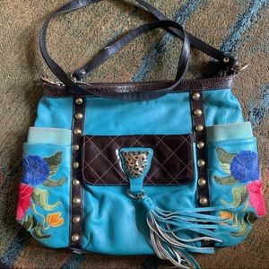 This is an authentic leather Sharif handbag.